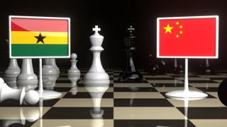 Ghana National Flag, The national flag on a chessboard with the Japanese flag in the background