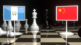 Guatemala National Flag, The national flag on a chessboard with the Japanese flag in the background