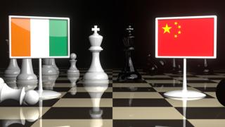 Ivory-Coast National Flag, The national flag on a chessboard with the Japanese flag in the background