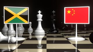 Jamaica National Flag, The national flag on a chessboard with the Japanese flag in the background