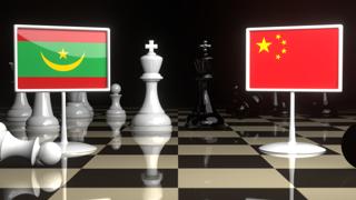 Mauritania National Flag, The national flag on a chessboard with the Japanese flag in the background