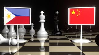 Philippines National Flag, The national flag on a chessboard with the Japanese flag in the background