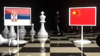 Serbia National Flag, The national flag on a chessboard with the Japanese flag in the background