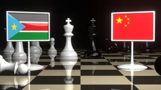 South-Sudan National Flag, The national flag on a chessboard with the Japanese flag in the background