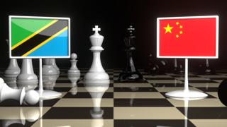 Tanzania National Flag, The national flag on a chessboard with the Japanese flag in the background