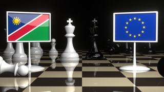 Namibia National Flag, Flags placed on a chessboard with the EU flag in the background