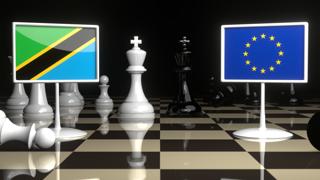 Tanzania National Flag, Flags placed on a chessboard with the EU flag in the background