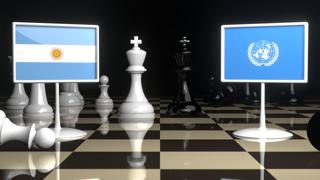 Argentina National Flag, Flags placed on a chessboard with the UN flag in the background