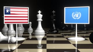 Liberia National Flag, Flags placed on a chessboard with the UN flag in the background