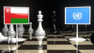 Oman National Flag, Flags placed on a chessboard with the UN flag in the background