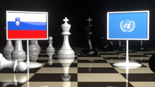 Slovenia National Flag, Flags placed on a chessboard with the UN flag in the background