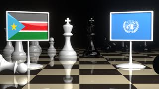 South-Sudan National Flag, Flags placed on a chessboard with the UN flag in the background