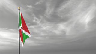 Burundi National Flag, The national flag and flagpole visible from afar against a black and white sky background