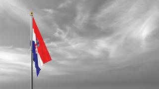 Croatia National Flag, The national flag and flagpole visible from afar against a black and white sky background