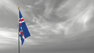 Iceland National Flag, The national flag and flagpole visible from afar against a black and white sky background