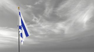 Israel National Flag, The national flag and flagpole visible from afar against a black and white sky background