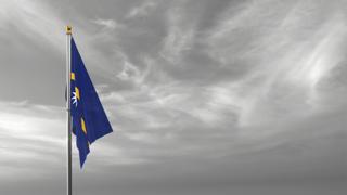 Nauru National Flag, The national flag and flagpole visible from afar against a black and white sky background