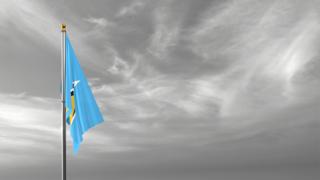 Saint-Lucia National Flag, The national flag and flagpole visible from afar against a black and white sky background