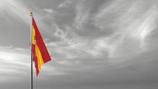 Spain National Flag, The national flag and flagpole visible from afar against a black and white sky background