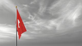 Switzerland National Flag, The national flag and flagpole visible from afar against a black and white sky background