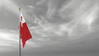 Tonga National Flag, The national flag and flagpole visible from afar against a black and white sky background