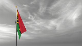 Vanuatu National Flag, The national flag and flagpole visible from afar against a black and white sky background