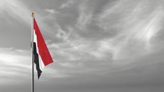 Yemen National Flag, The national flag and flagpole visible from afar against a black and white sky background