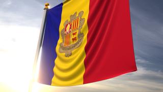 Andorra National Flag, A fluttering flag and flagpole seen up close against a dark blue sky