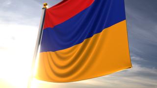 Armenia National Flag, A fluttering flag and flagpole seen up close against a dark blue sky