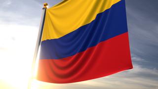 Colombia National Flag, A fluttering flag and flagpole seen up close against a dark blue sky