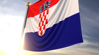 Croatia National Flag, A fluttering flag and flagpole seen up close against a dark blue sky