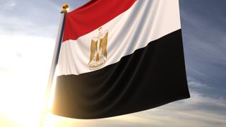 Egypt National Flag, A fluttering flag and flagpole seen up close against a dark blue sky