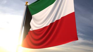 Kuwait National Flag, A fluttering flag and flagpole seen up close against a dark blue sky