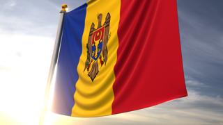 Moldova National Flag, A fluttering flag and flagpole seen up close against a dark blue sky