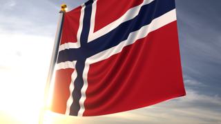 Norway National Flag, A fluttering flag and flagpole seen up close against a dark blue sky