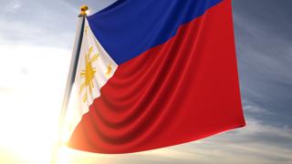 Philippines National Flag, A fluttering flag and flagpole seen up close against a dark blue sky