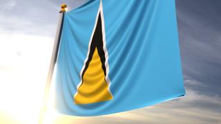 Saint-Lucia National Flag, A fluttering flag and flagpole seen up close against a dark blue sky