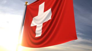 Switzerland National Flag, A fluttering flag and flagpole seen up close against a dark blue sky