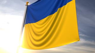 Ukraine National Flag, A fluttering flag and flagpole seen up close against a dark blue sky