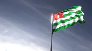 Abkhazia National Flag, The national flag and flagpole looking up against a dark blue sky