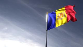 Andorra National Flag, The national flag and flagpole looking up against a dark blue sky