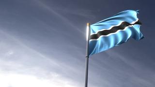 Botswana National Flag, The national flag and flagpole looking up against a dark blue sky