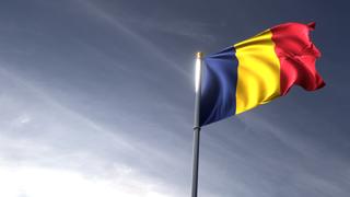 Chad National Flag, The national flag and flagpole looking up against a dark blue sky