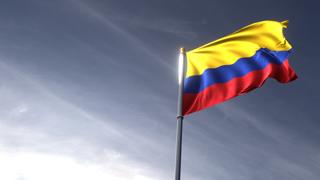 Colombia National Flag, The national flag and flagpole looking up against a dark blue sky