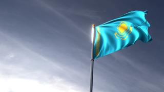 Kazakhstan National Flag, The national flag and flagpole looking up against a dark blue sky