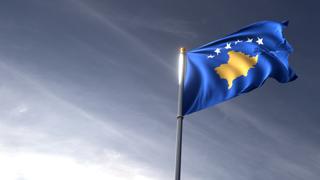 Kosovo National Flag, The national flag and flagpole looking up against a dark blue sky