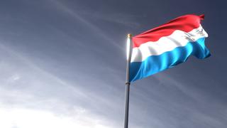 Luxembourg National Flag, The national flag and flagpole looking up against a dark blue sky