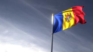 Moldova National Flag, The national flag and flagpole looking up against a dark blue sky