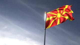 North-Macedonia National Flag, The national flag and flagpole looking up against a dark blue sky