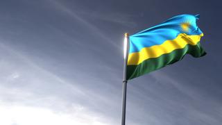 Rwanda National Flag, The national flag and flagpole looking up against a dark blue sky